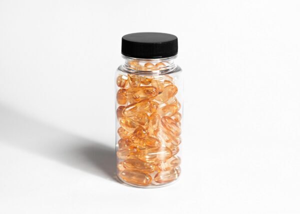 glass medication bottle with amber colored gel pills