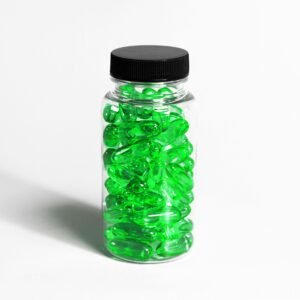 glass medication bottle with green colored gel pills